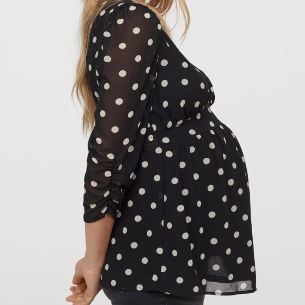 Flattering, never worn maternity top.